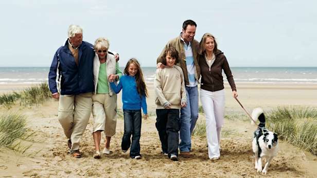 Family walking on a beach