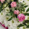 Zoomed in shot of pillow-shaped floral display in pink