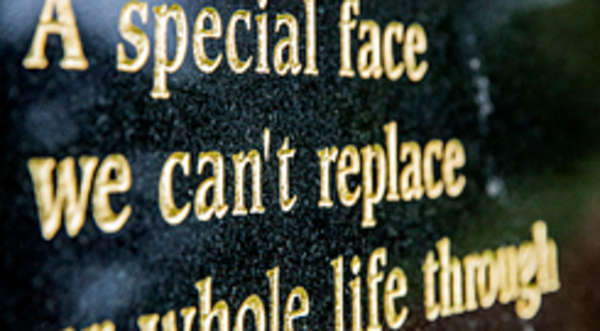 memorial lettering inscriptions on a headstone