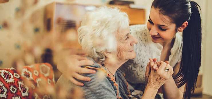 Grandmother and daughter holding hands
