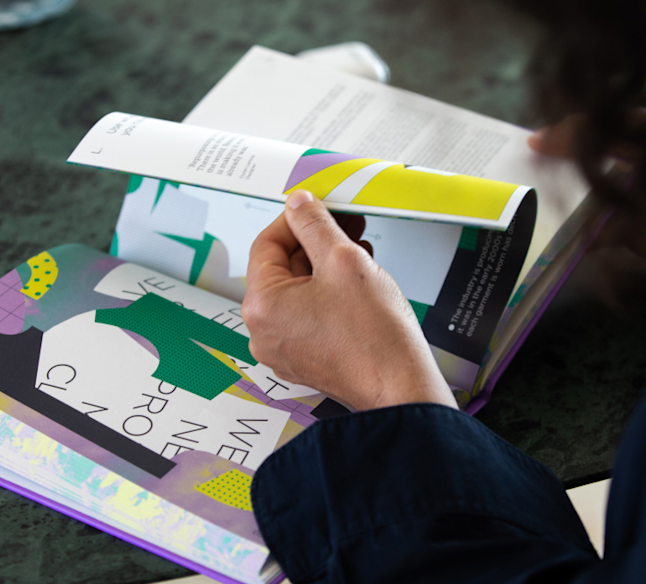 person reading the fashion book