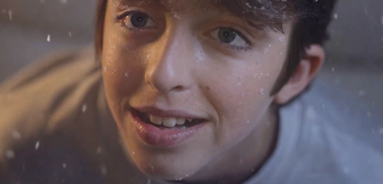 family youngster smiles about first snow 1310x630