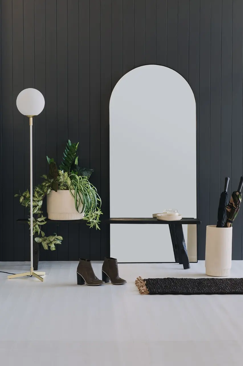 black wall and mirror