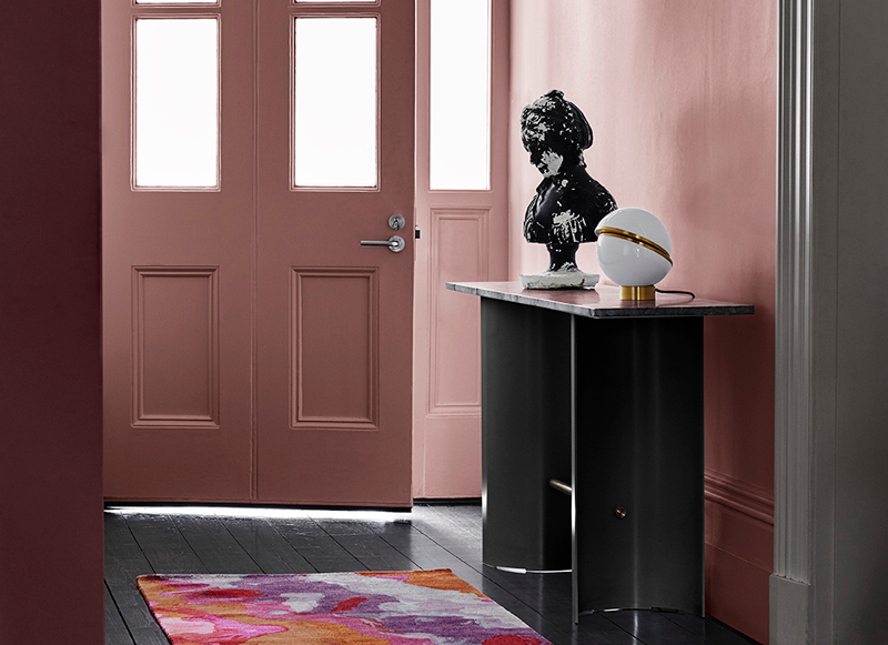 Inside front door Hallway in tradition home in Dulux Terra Rose, walls in Rose Pink Villa and trims in Lexicon Half. Black hardwood floors, black hallway table.