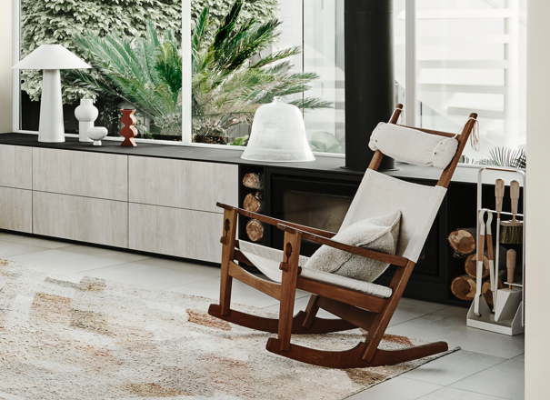 White and wooden rocking chair in modern living room.