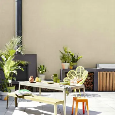 Outdoor seating area with textured wall paint and fireplace