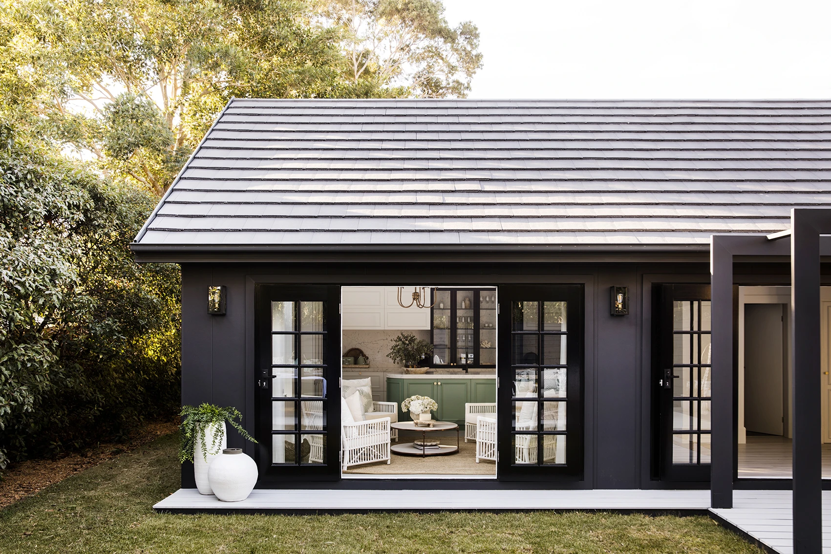 Exterior: Domino
Decking: Colorbond Shale Grey

Black exterior:  The Bold Extension – House 9 by Three Birds Renovations. 
