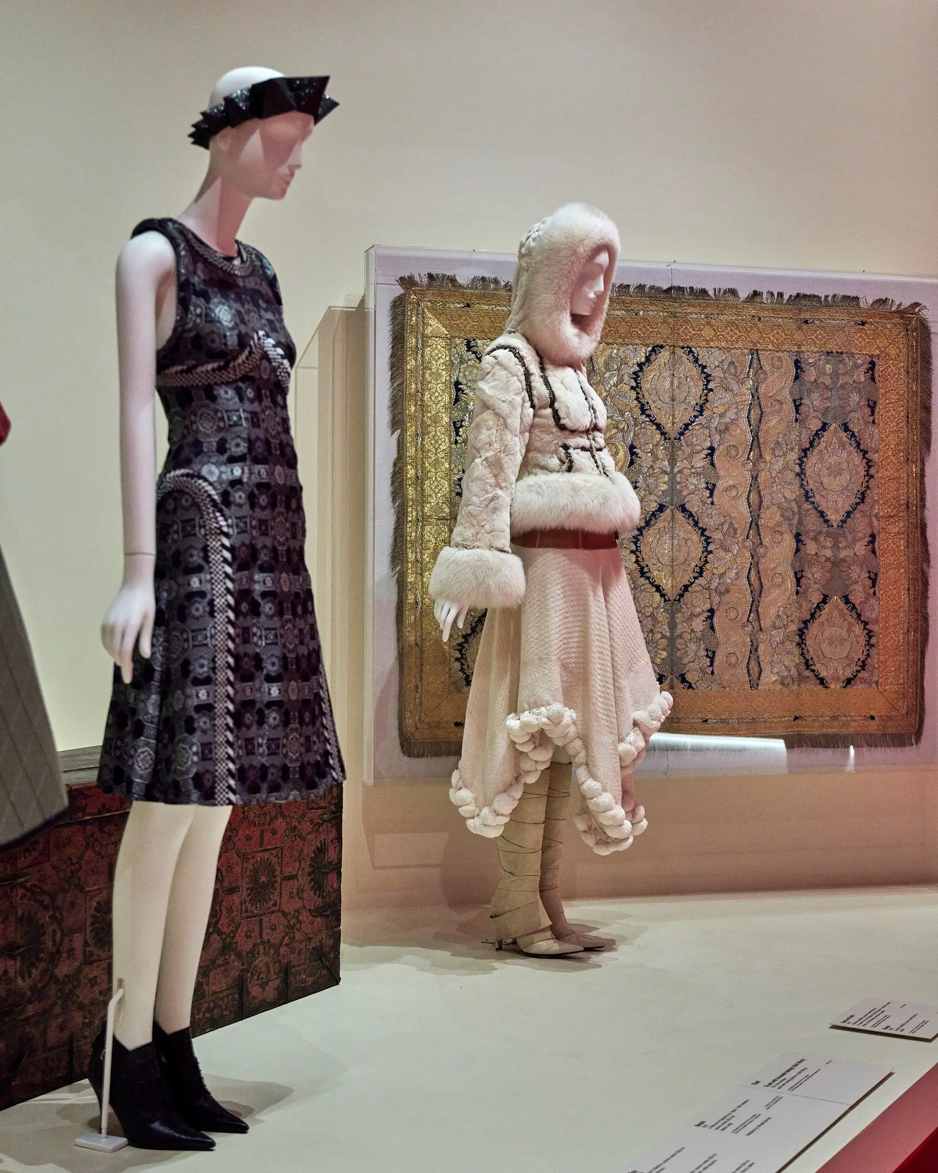 NGV Alexander McQueen hooded mannequin against cream wall