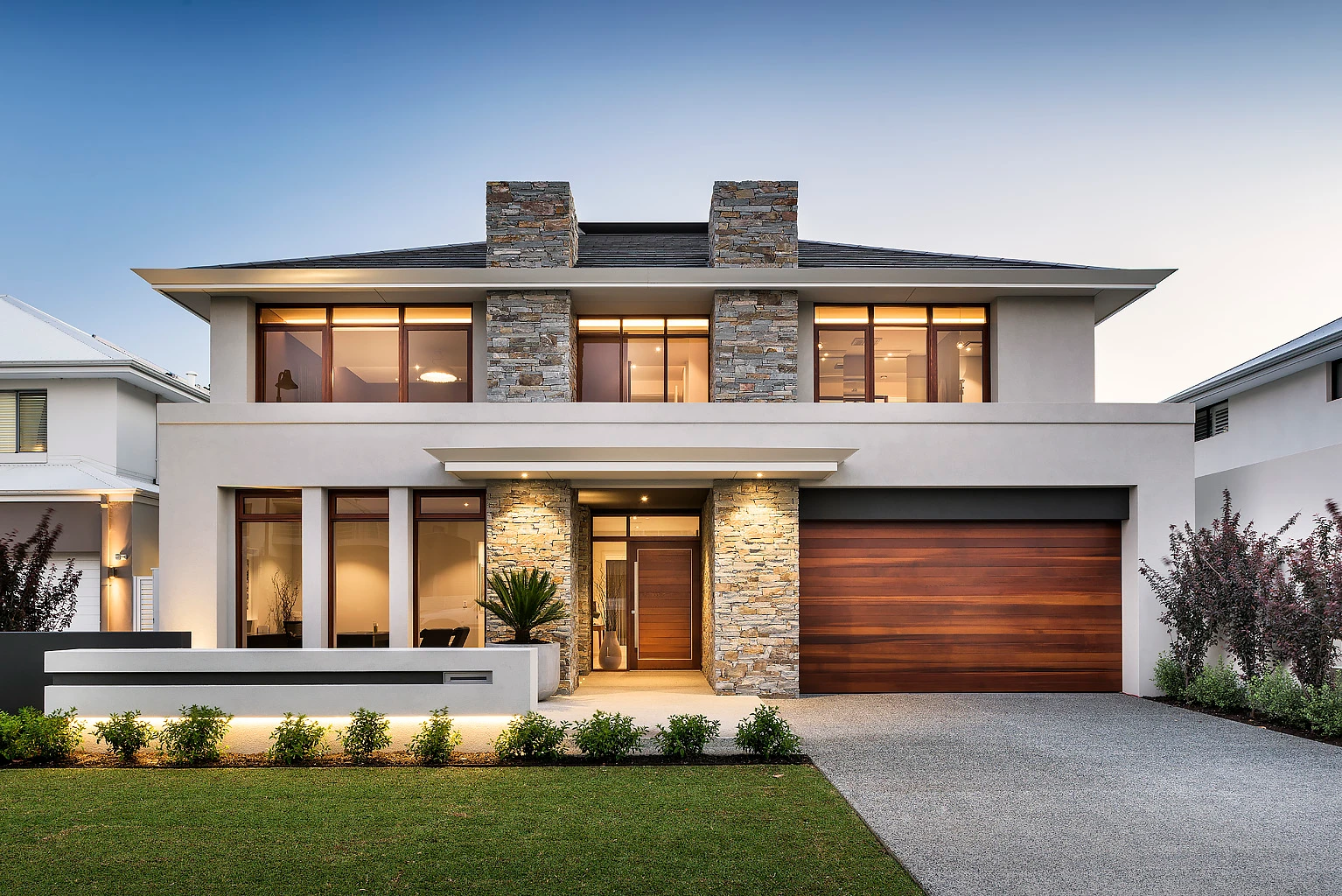 Double-storey house with stone pillars