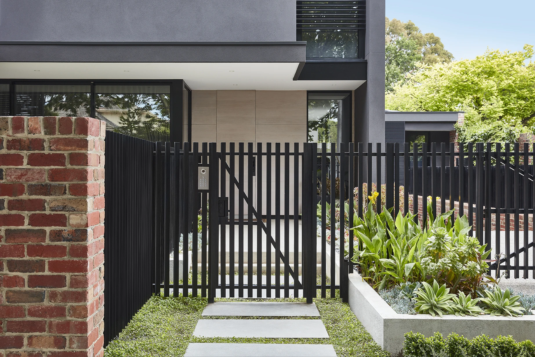 Modern black bar front fence and gate