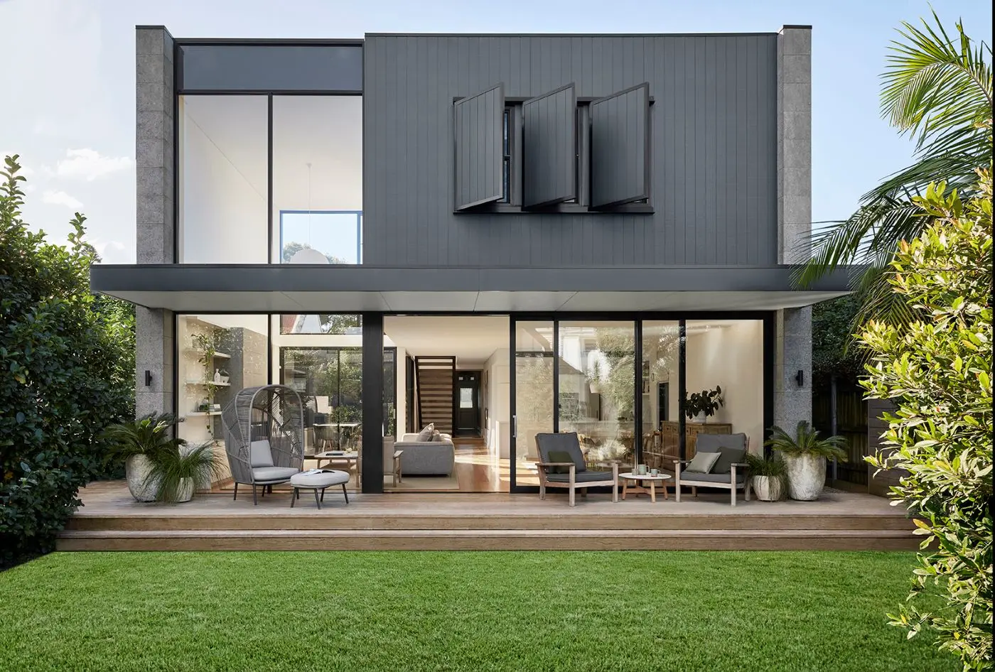 Dark modern charcoal house exterior with timber deck