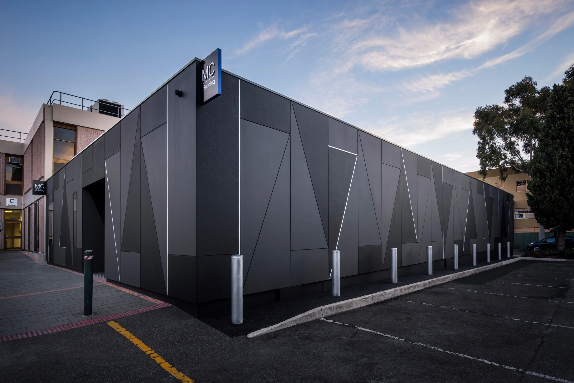 University building with geometric patterned exterior in charcoals and greys.