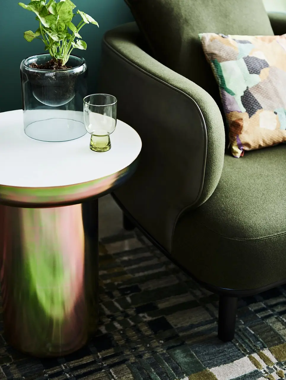 interior green lounge with couch and green glass.