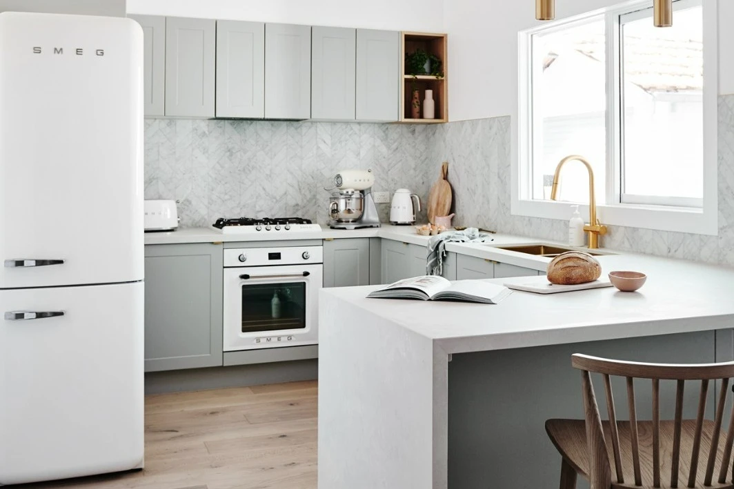 Grey and white kitchen with peninsula bench