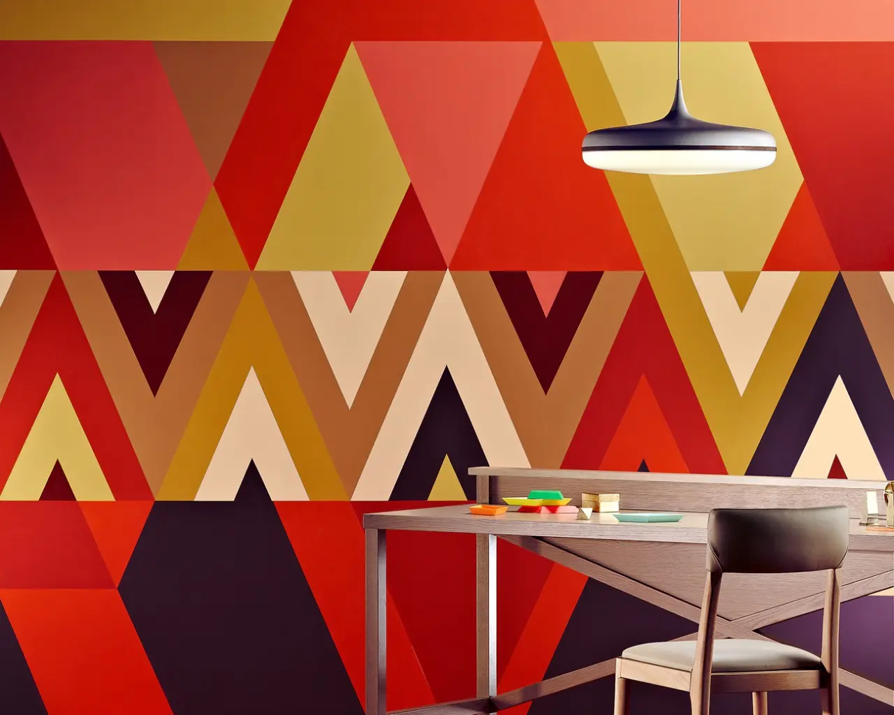 Triangular geometric wall with red, yellow and brown contrasts Dulux Wash&Wear® Tango, Hot Chillie, Crop Circle, Smoked Amethyst, Curd, Mid Tan, Red Clown, Tangerine Bliss, and Bunging Brier.