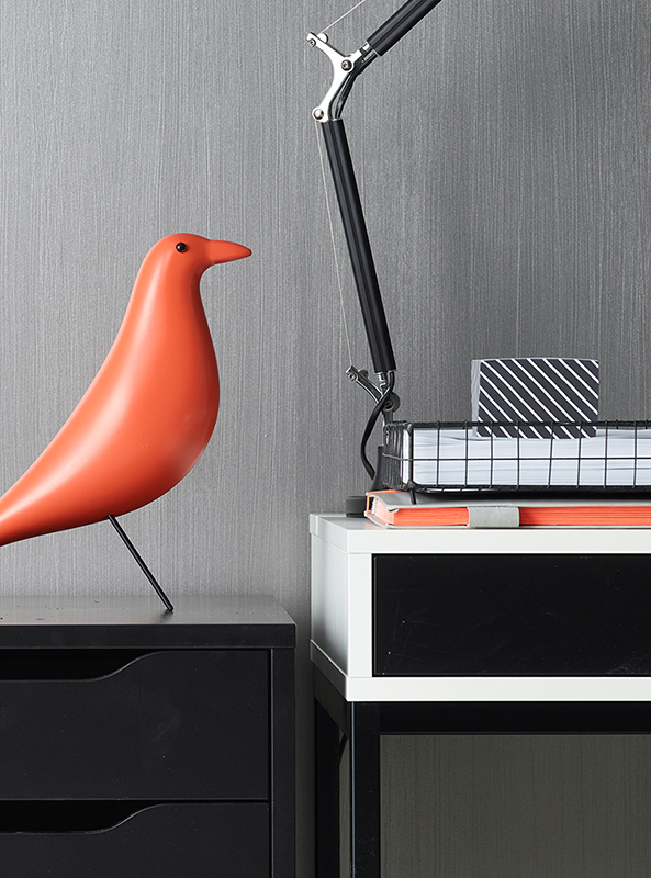 interior study desk closeup, red bird sculpture.