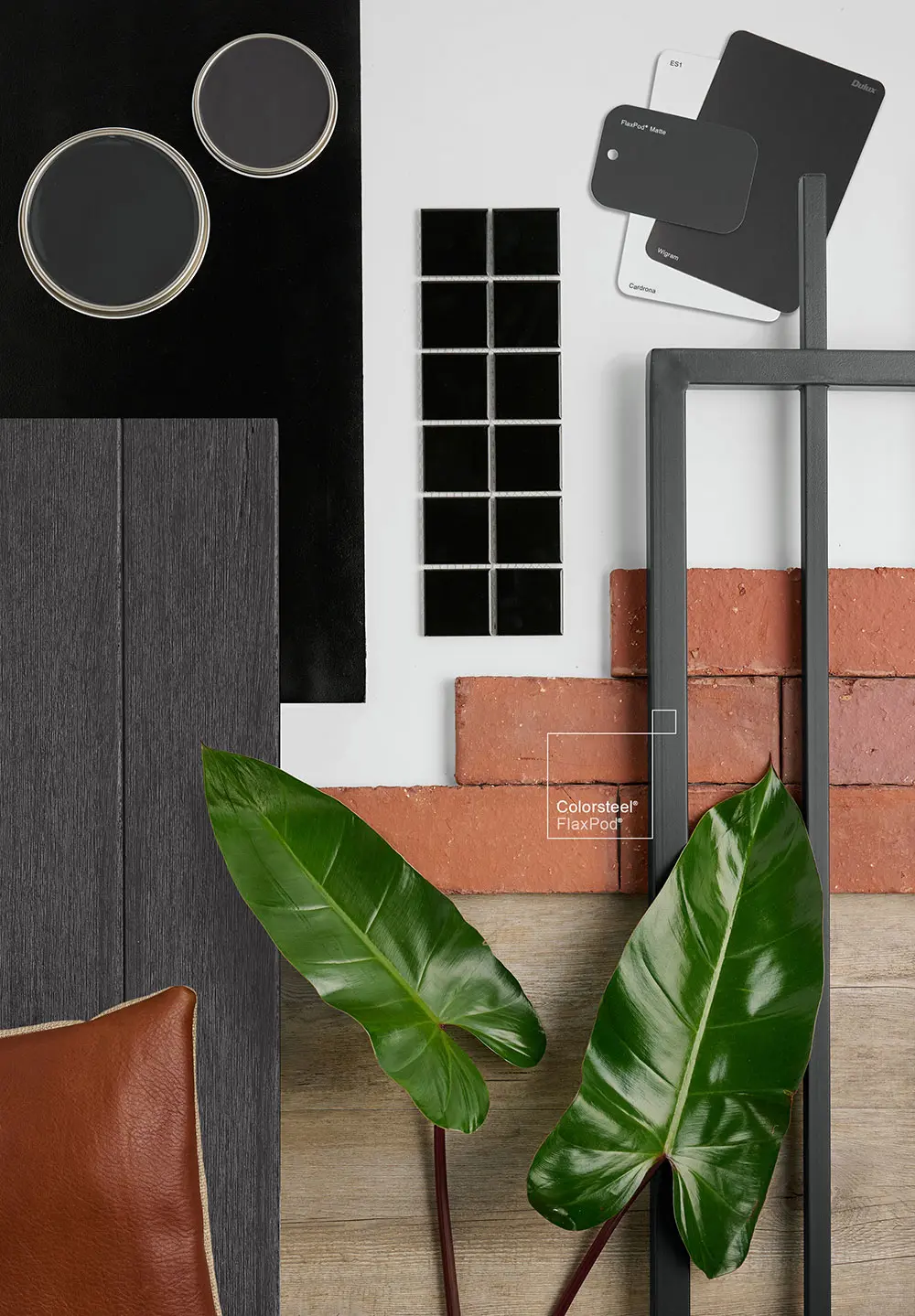 Flat lay of different materials including brick and foliage