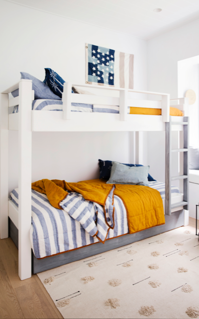 hinterland kids bedroom in white with bunk beds and blue linen