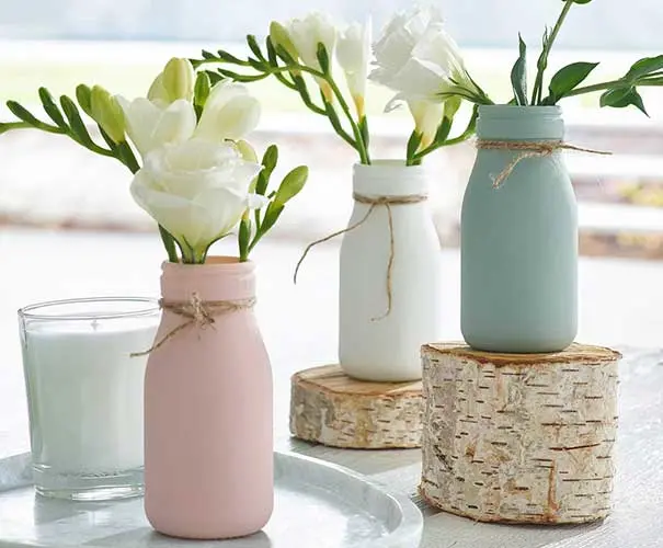Two vases spray painted in chalky finish
