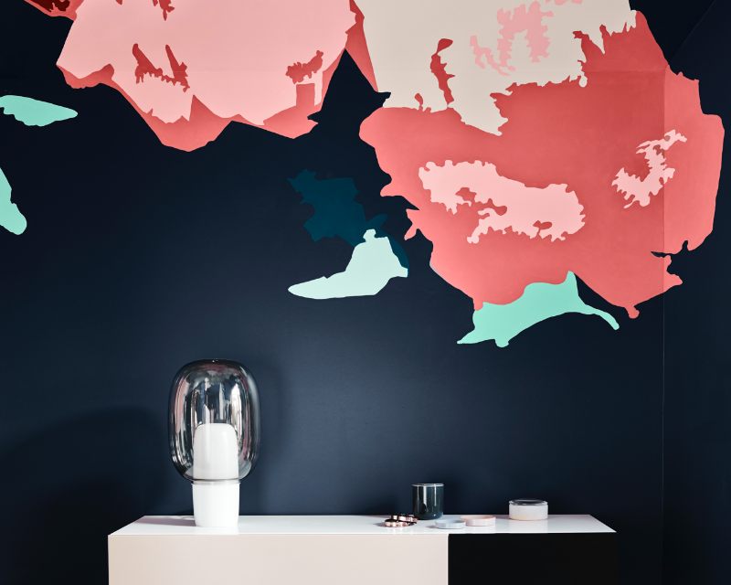 view of table top next to flower graphic wall