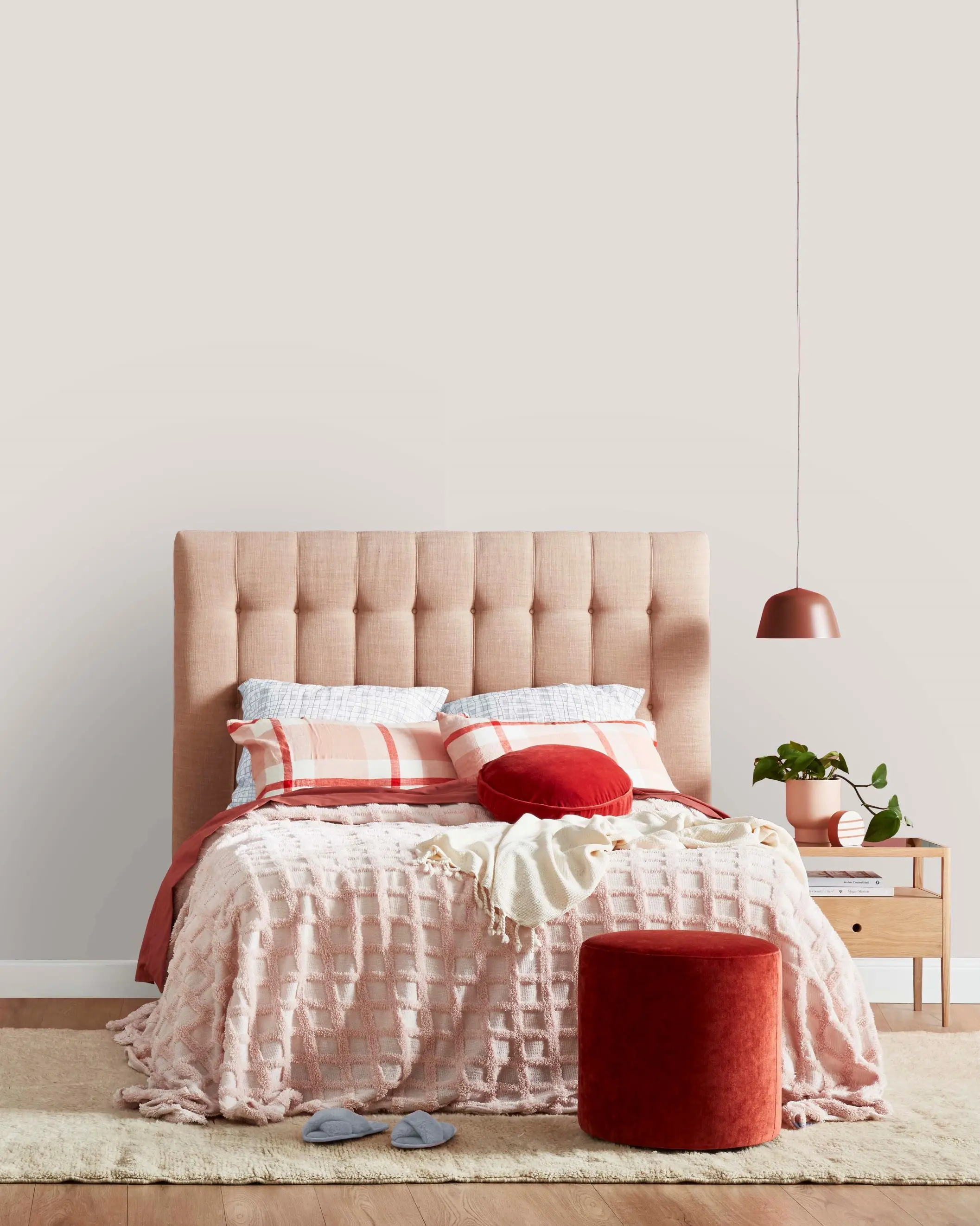 White bedroom with pink bedhead