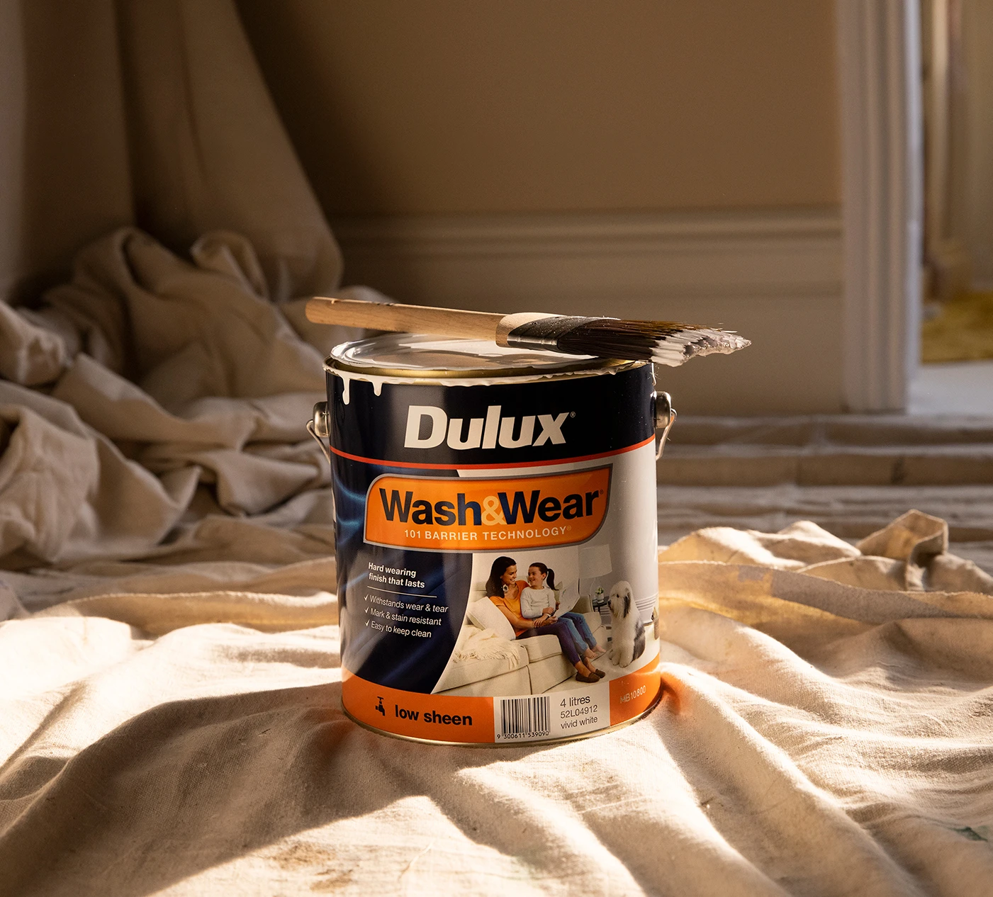 Can of Dulux Wash&Wear on drop sheet