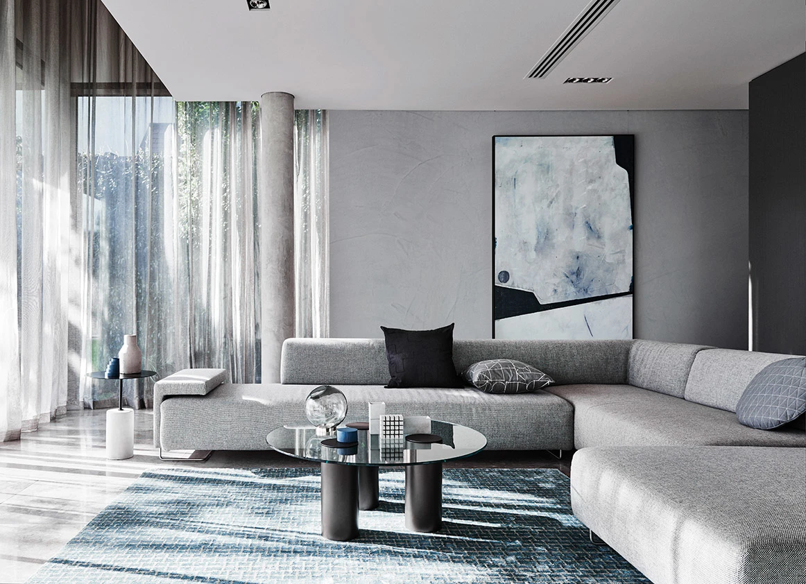 interior grey lounge with couch and glass coffee table.
