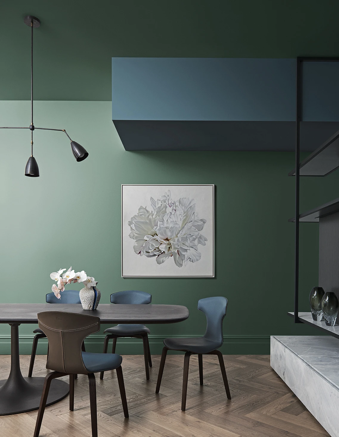 Dining room with green walls and blue bulkhead