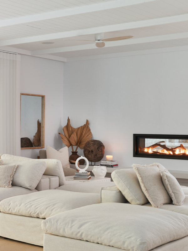 Minimalist lounge room with fireplace