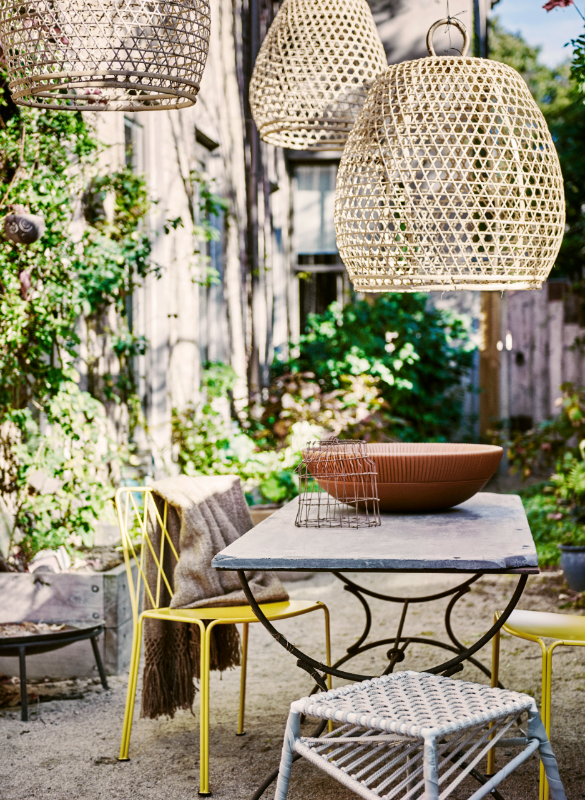 Outdoor dining table and chairs with cane lampshades