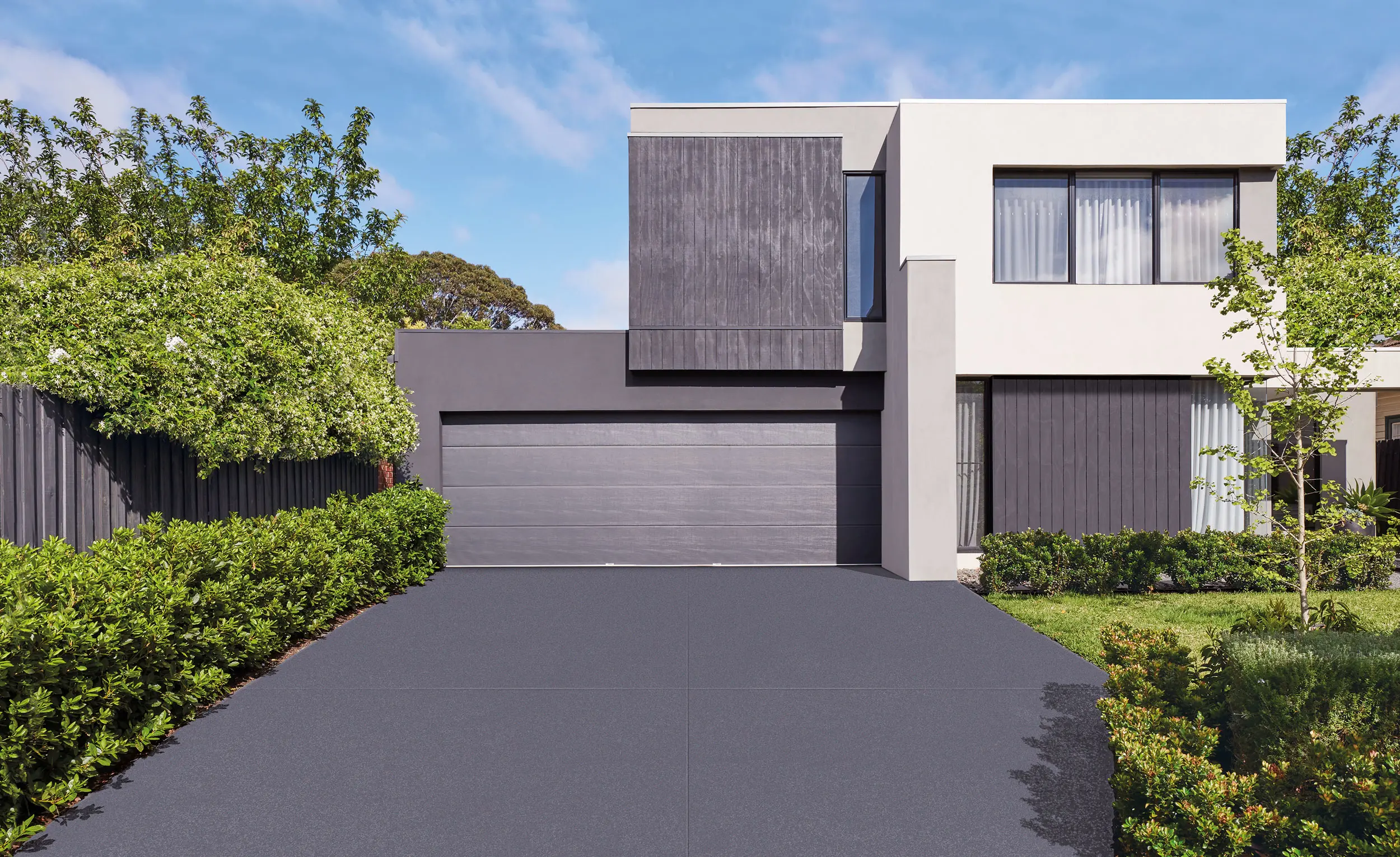Modern cream and grey house with grey driveway