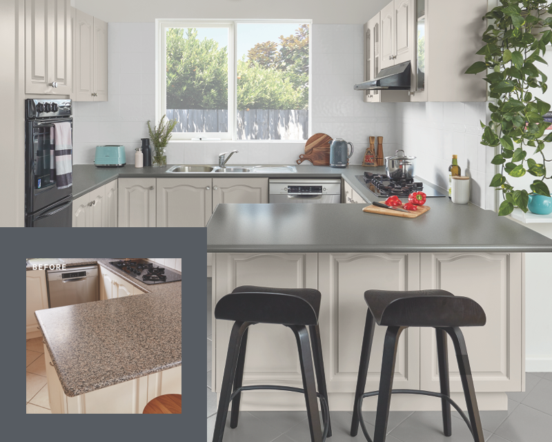 kitchen with grey bench and cream cabinets