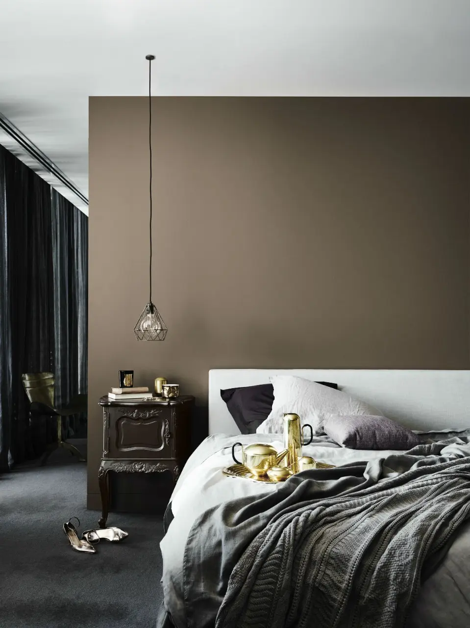 Bedroom with brown wall and hanging pendant light