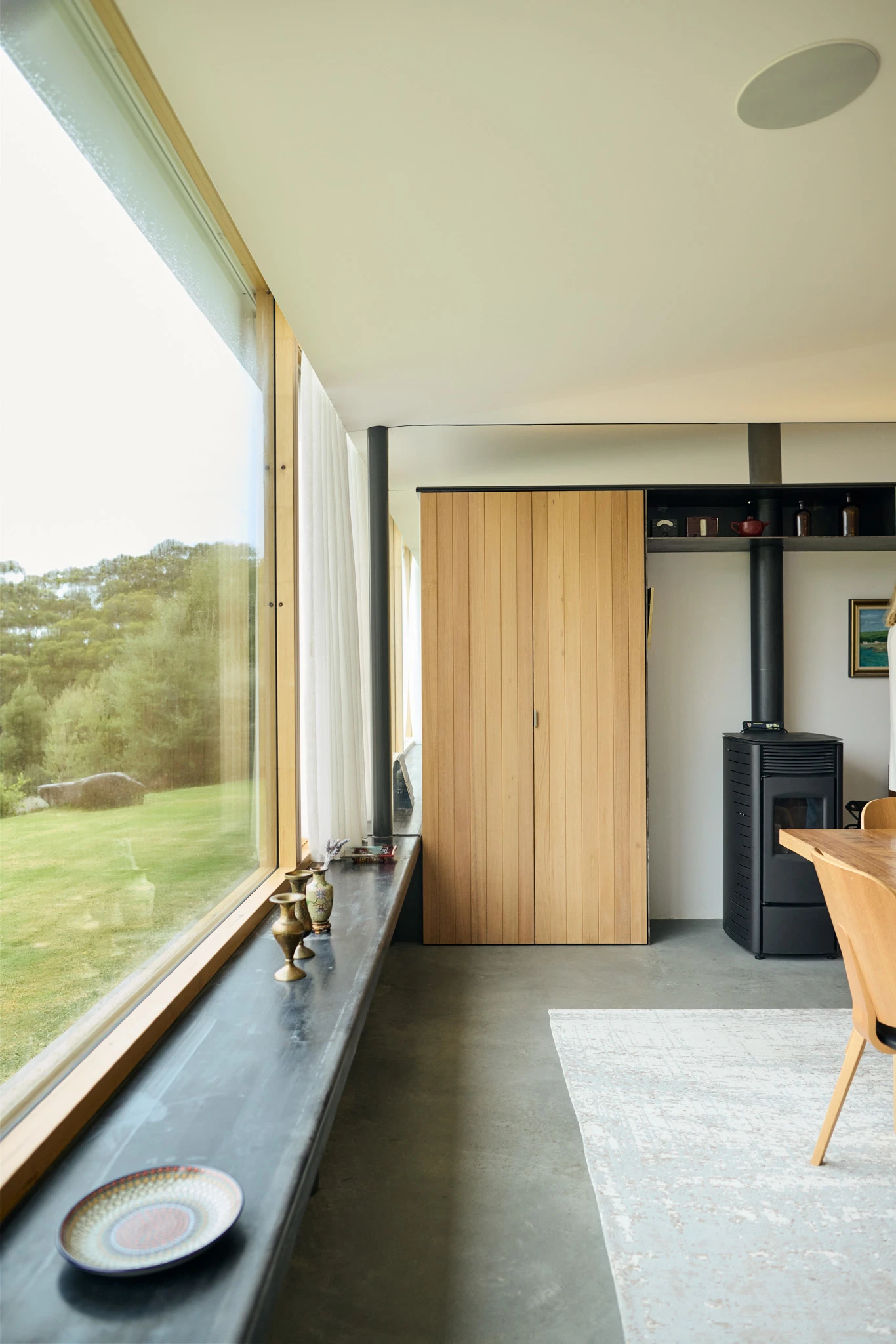 Window bench in living area with concrete floor