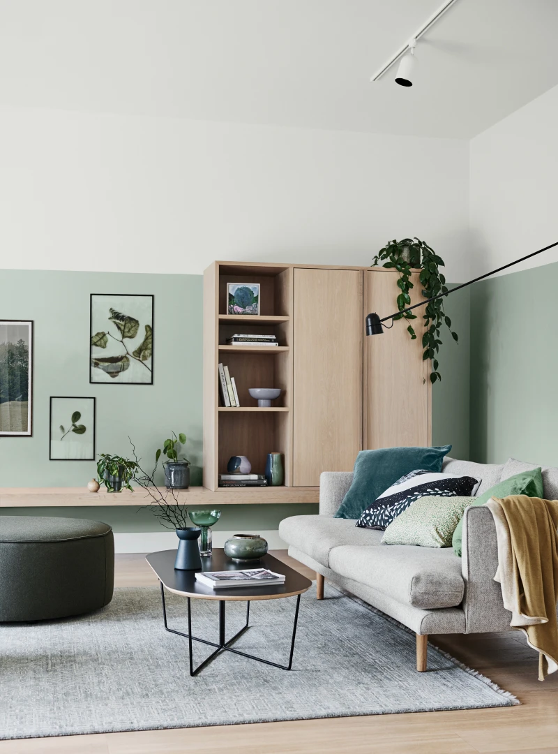 View of green and wood living room for Seasonal Trends 2020. 