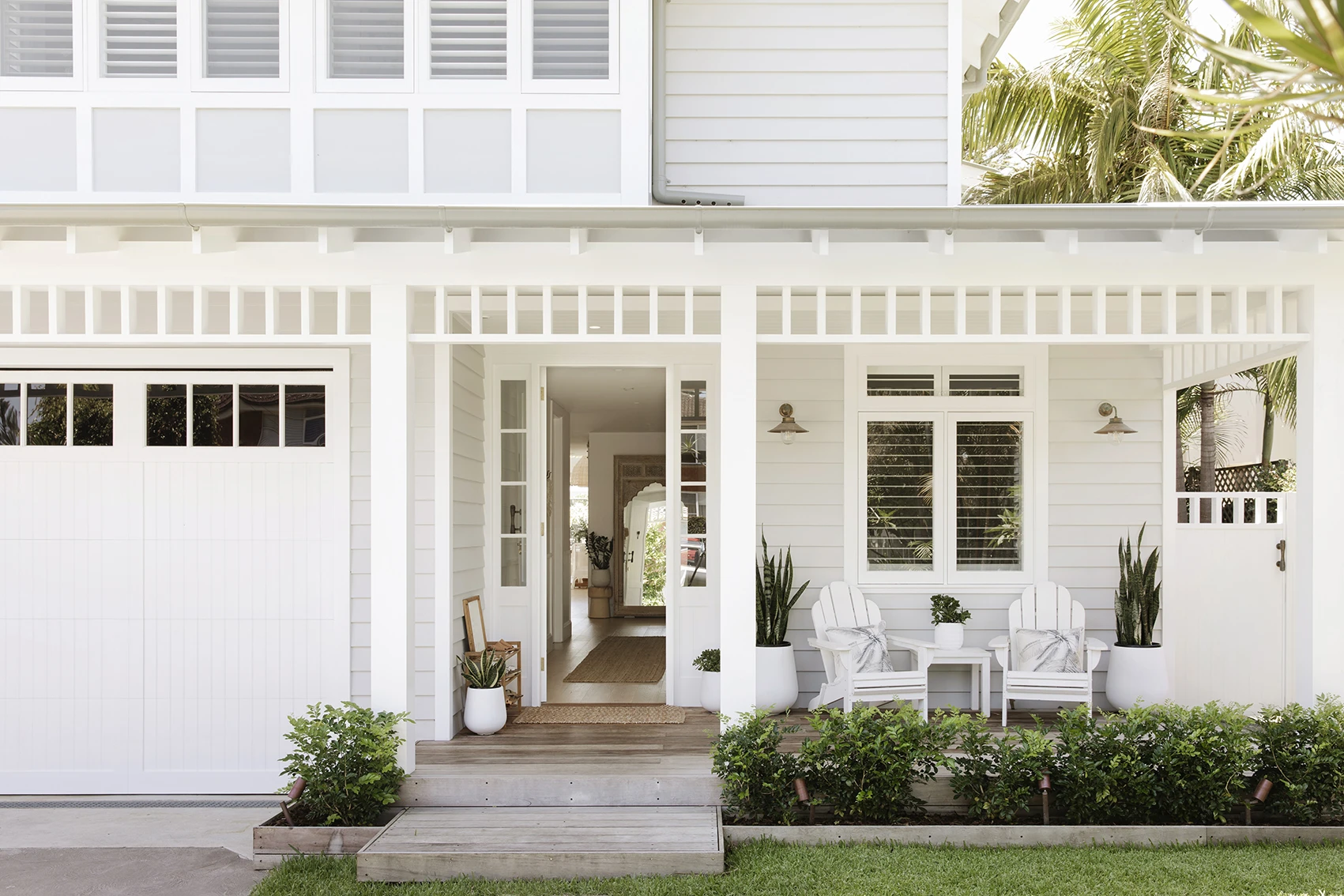 White and grey weatherboard double-storey house