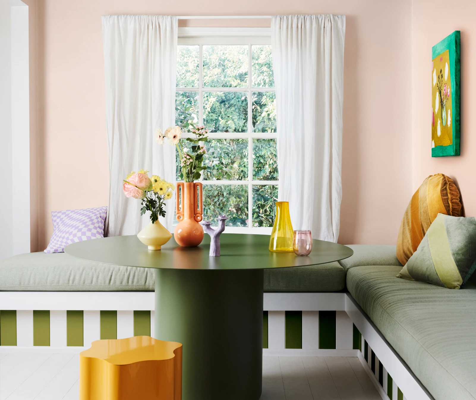 Interior build in dining table area with Pinkham coloured walls and olive and yellow accents