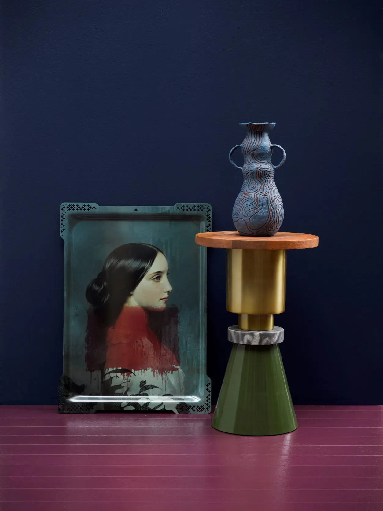 A vase and paining of a woman