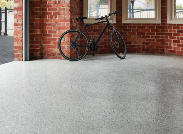 Bicycle parked on a garage floor with Dulux Avista epoxy flooring