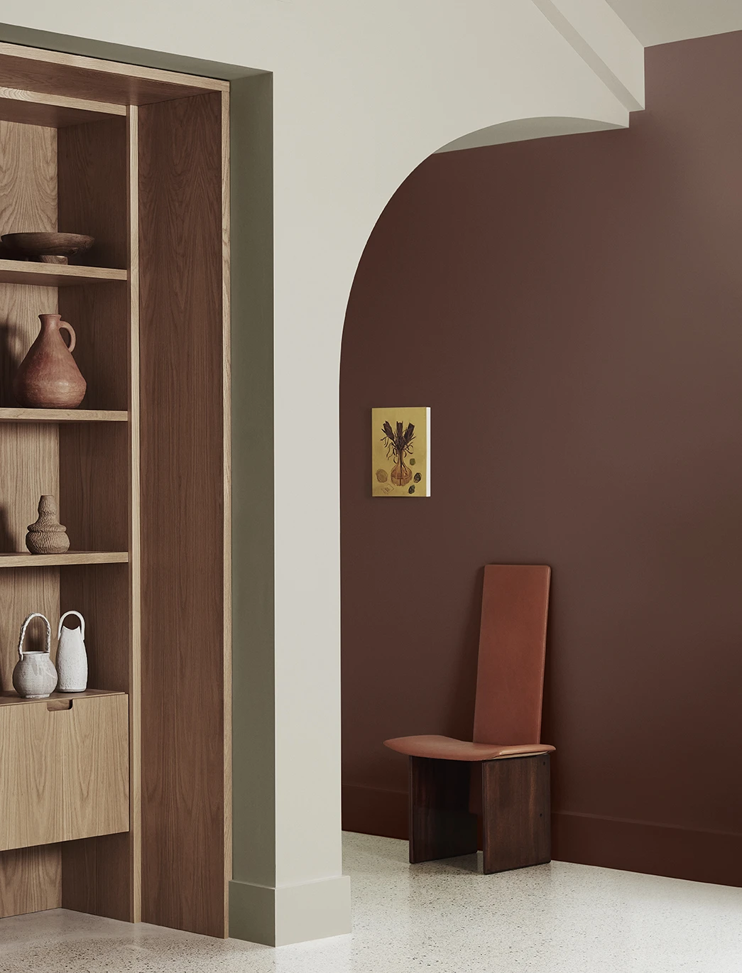 Timber bookcase alongside beige arch and brown wall