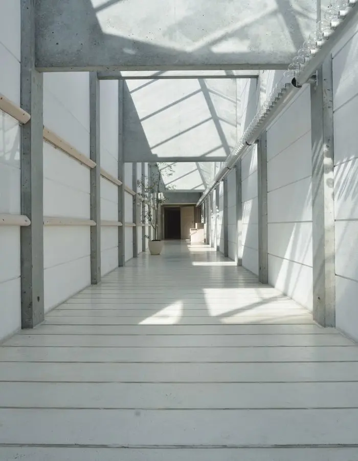 interior white hallway with beams.