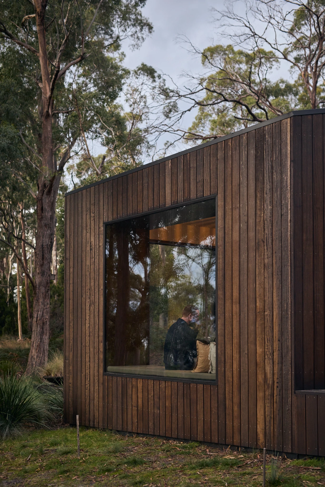 Exterior weatherboard house with large plate glass window