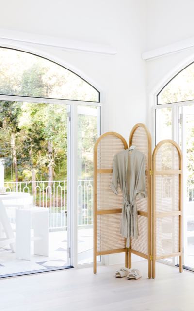 Hinterland bedroom in Dulux White on White with cane room divider