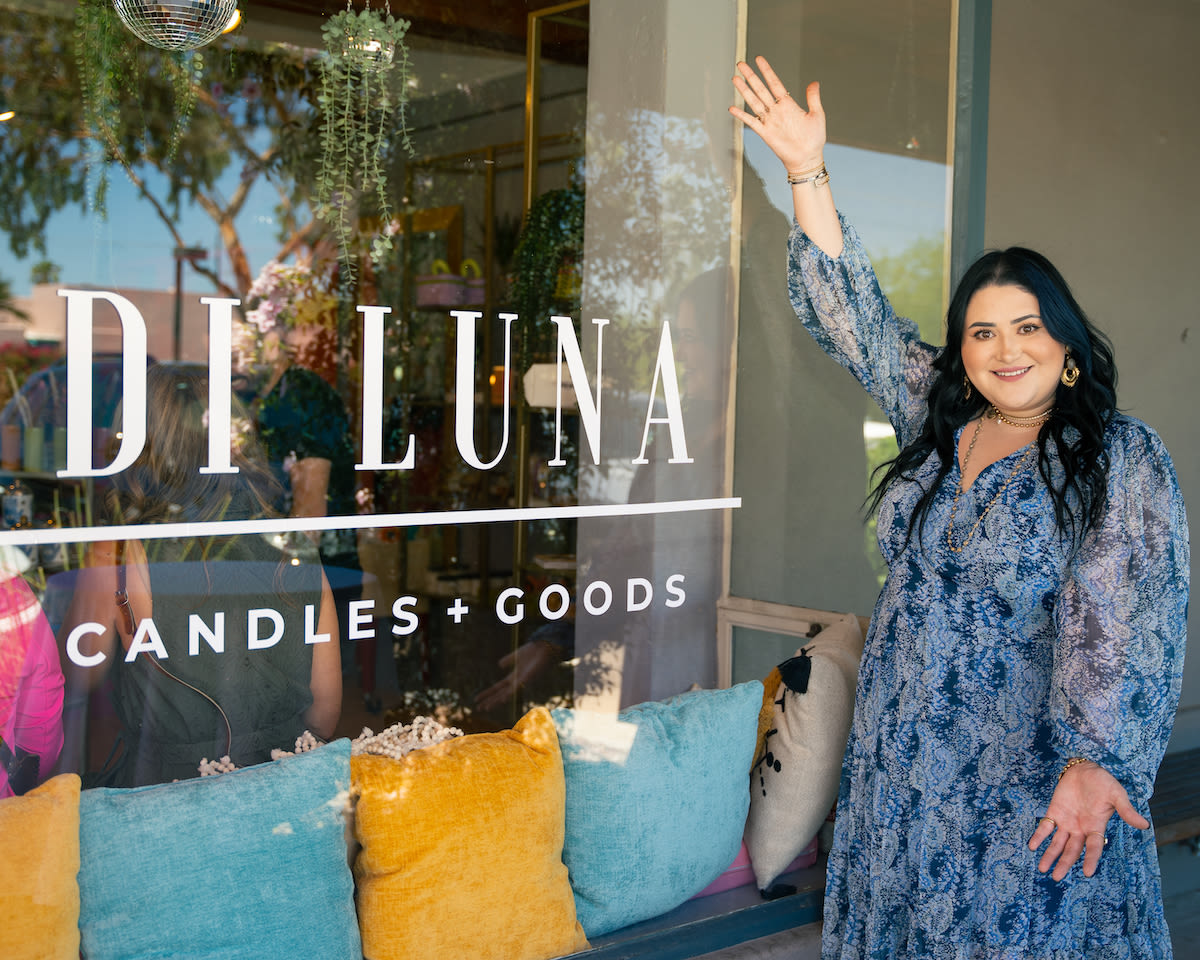 Maria with her storefront, Di Luna candles