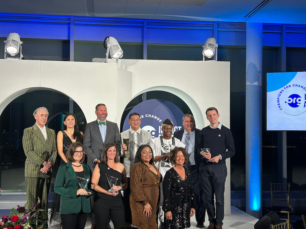 Representatives from the seven award winning organizations at the 2024 .ORG Impact Awards