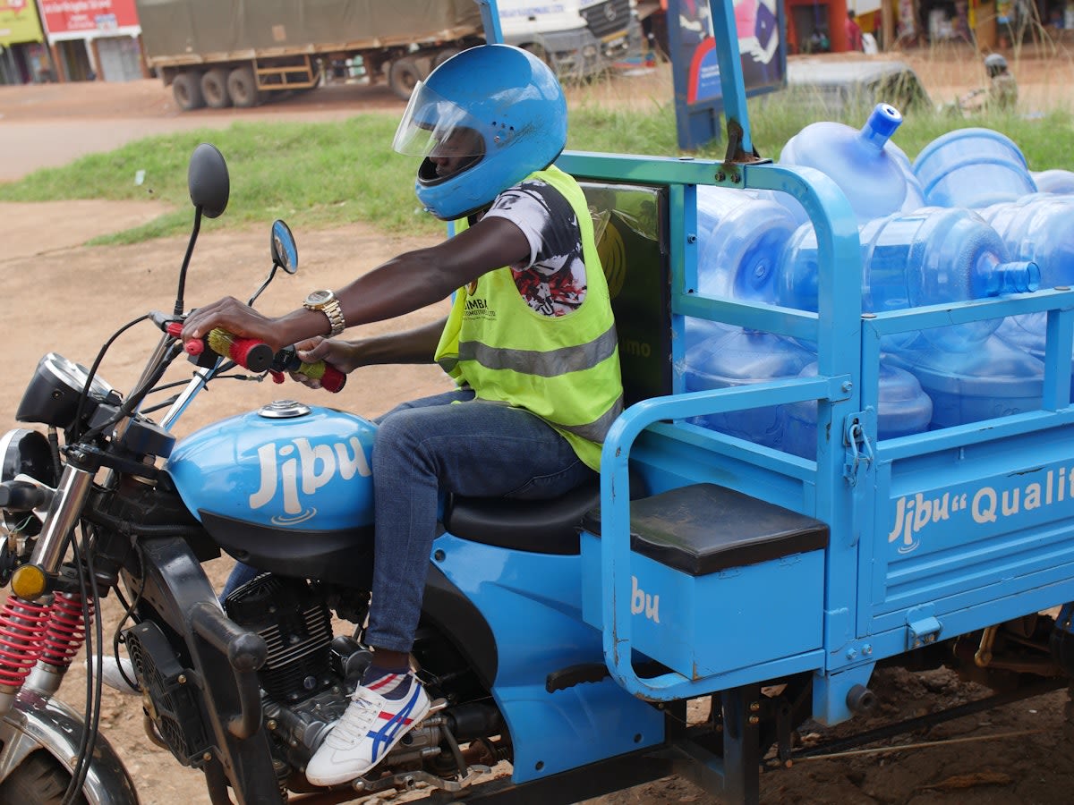A Jibu franchise owner on his delivery motor bike