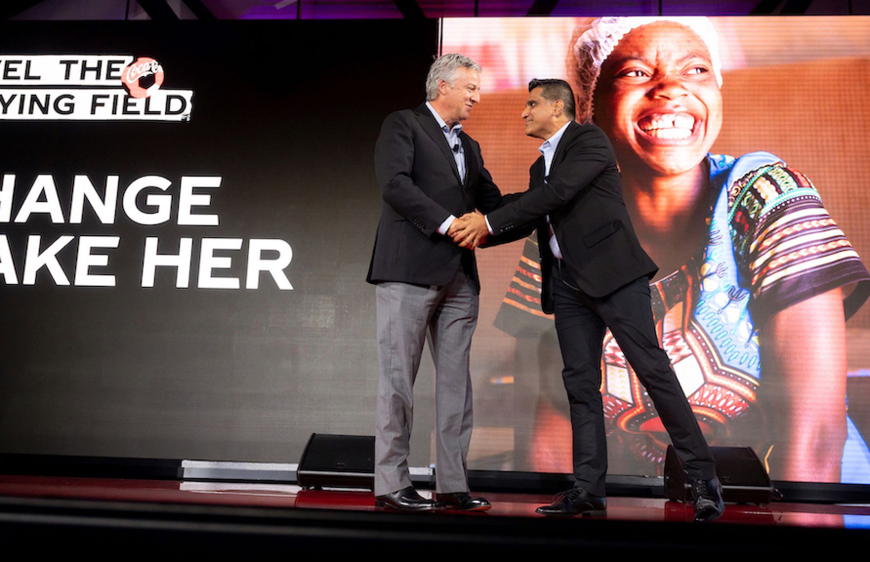 John Murphy, President and CFO of The Coca-Cola Company, and Vishal Ghotge, CEO of Kiva, announcing the new partnership between the organizations
