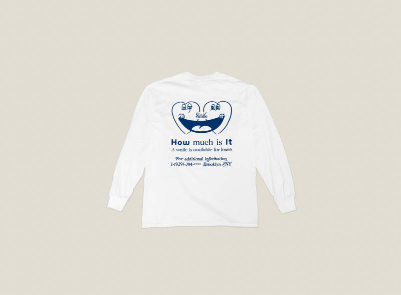 Printed on the back of the t-shirt is a character with a heart that wreathes a smile.