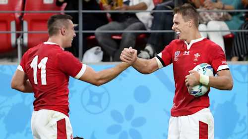 Liam Williams and Josh Adams celebrate Wales' try against Georgia