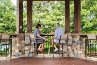 A couple sits at the bar in the Gazebo.
